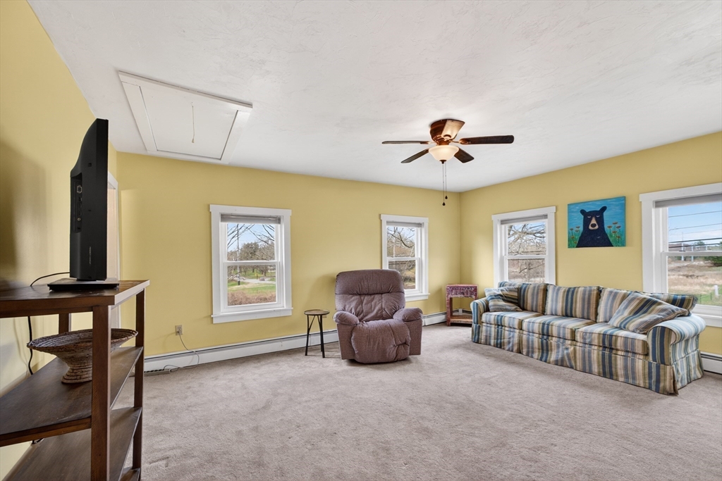 47 Singletary Avenue Sutton, MA 01590 - Photo 29 of 42 a living room with furniture and a window