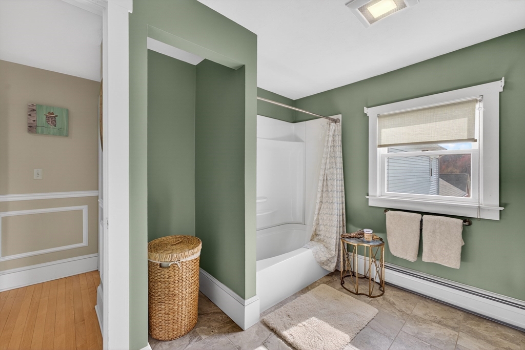 47 Singletary Avenue Sutton, MA 01590 - Photo 32 of 42 a living room with furniture and a window