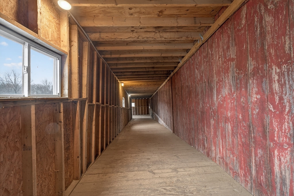 47 Singletary Avenue Sutton, MA 01590 - Photo 38 of 42 a view of a hallway with wooden walls