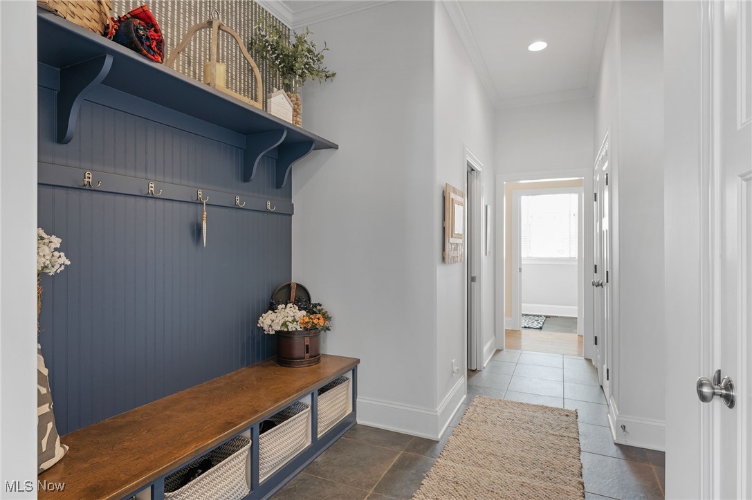 3777 Hunting Run Road Medina, OH 44256 - Photo 20 of 46 Mudroom with crown molding and dark tile patterned flooring