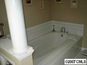 4322 Applegate Road Charlotte, NC 28209 - Photo 5 of 8 a bathroom with a bathtub