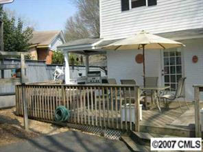 4322 Applegate Road Charlotte, NC 28209 - Photo 6 of 8 a view of a house with a balcony