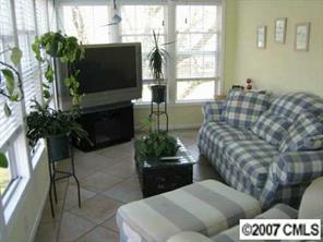 4322 Applegate Road Charlotte, NC 28209 - Photo 8 of 8 a living room with furniture and a flat screen tv