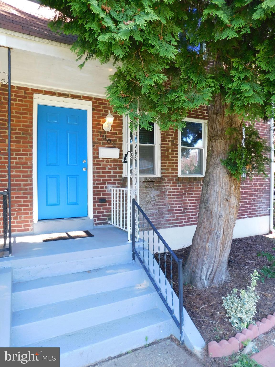 7009 Fieldcrest Road Baltimore, MD 21215 - Photo 2 of 46 a view of a porch with wooden floor and fence