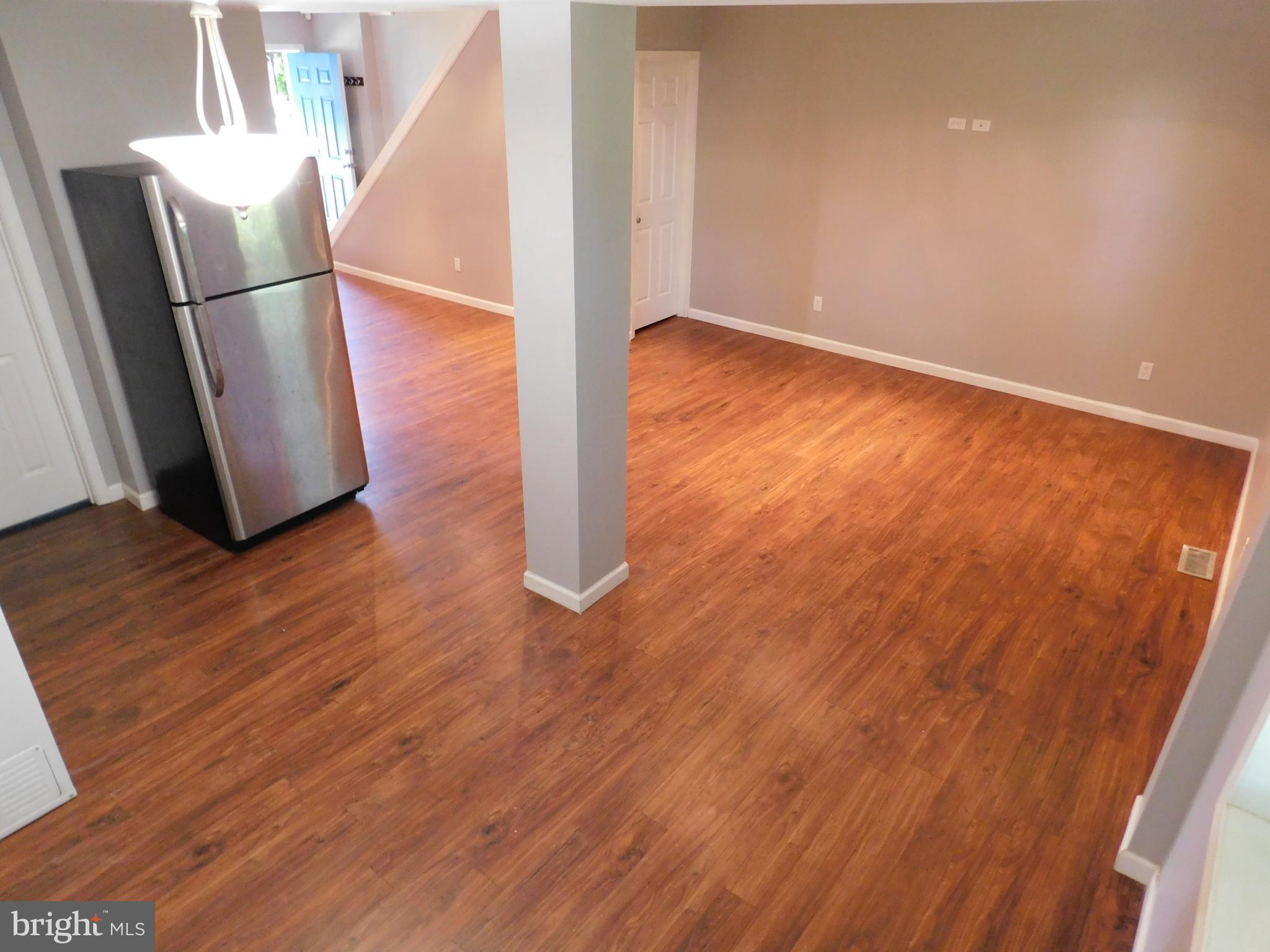 7009 Fieldcrest Road Baltimore, MD 21215 - Photo 9 of 46 a view of a room with wooden floor