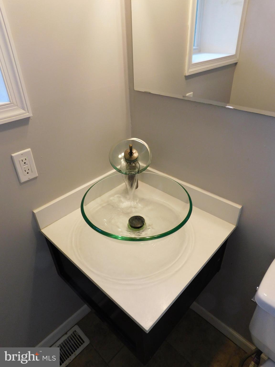 7009 Fieldcrest Road Baltimore, MD 21215 - Photo 11 of 46 a sink sitting under a window