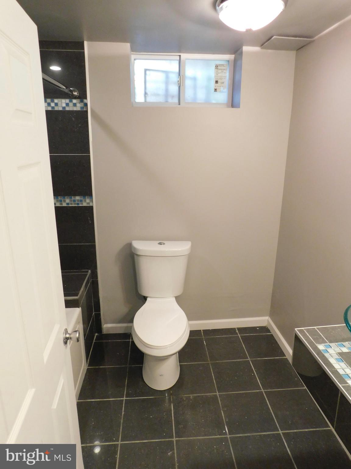 7009 Fieldcrest Road Baltimore, MD 21215 - Photo 16 of 46 a bathroom with a toilet