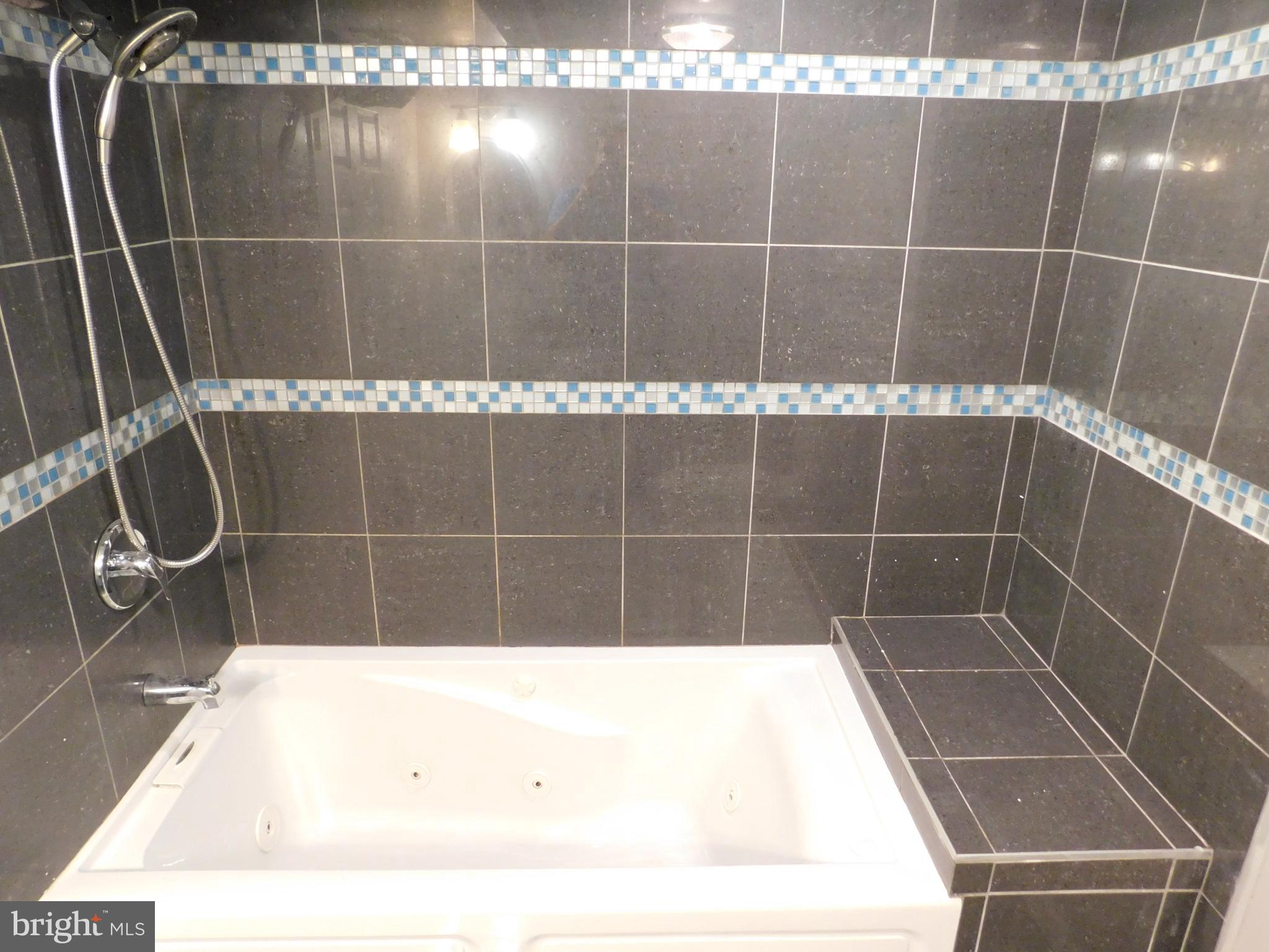 7009 Fieldcrest Road Baltimore, MD 21215 - Photo 18 of 46 a bathroom with a shower