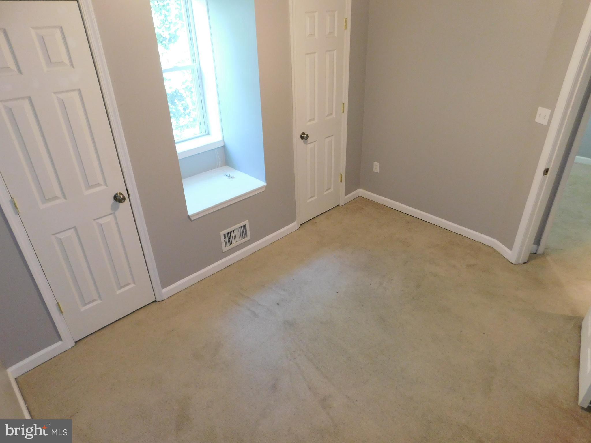 7009 Fieldcrest Road Baltimore, MD 21215 - Photo 22 of 46 a view of an empty room and a window