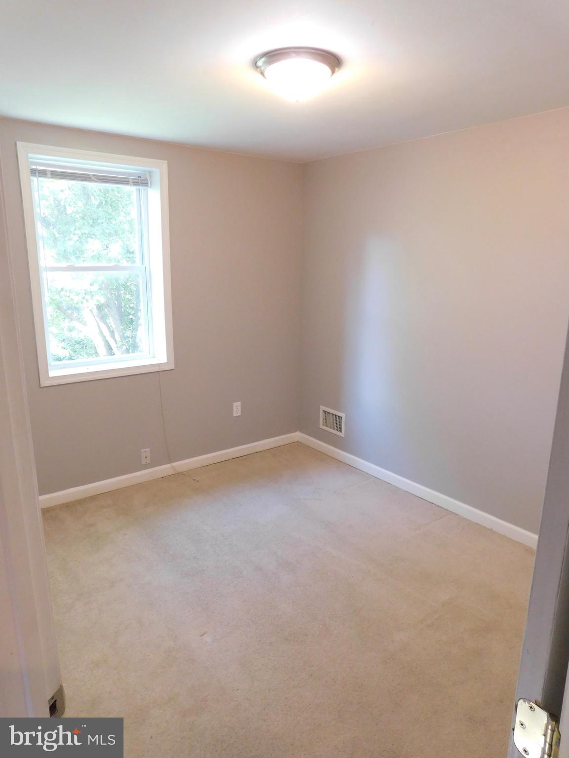 7009 Fieldcrest Road Baltimore, MD 21215 - Photo 23 of 46 an empty room with a window