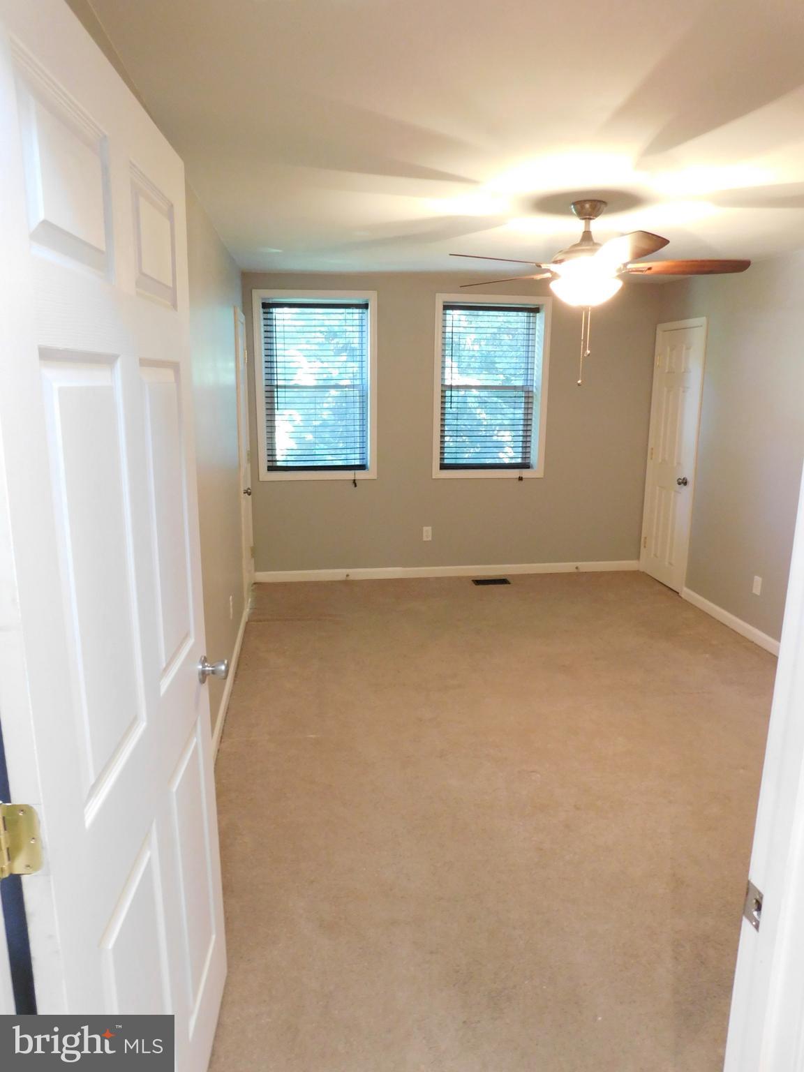 7009 Fieldcrest Road Baltimore, MD 21215 - Photo 28 of 46 an empty room with windows