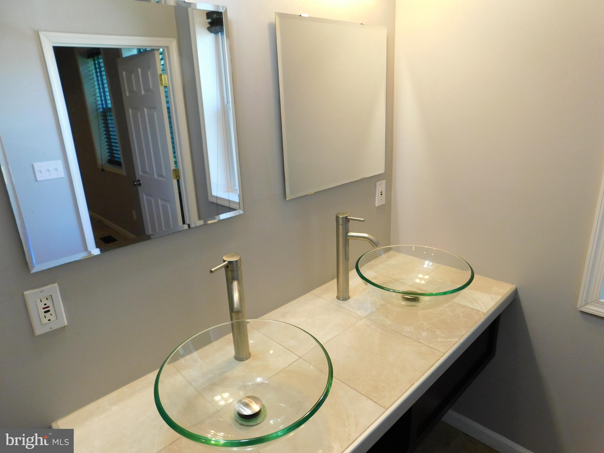 7009 Fieldcrest Road Baltimore, MD 21215 - Photo 32 of 46 a bathroom with a sink and a mirror