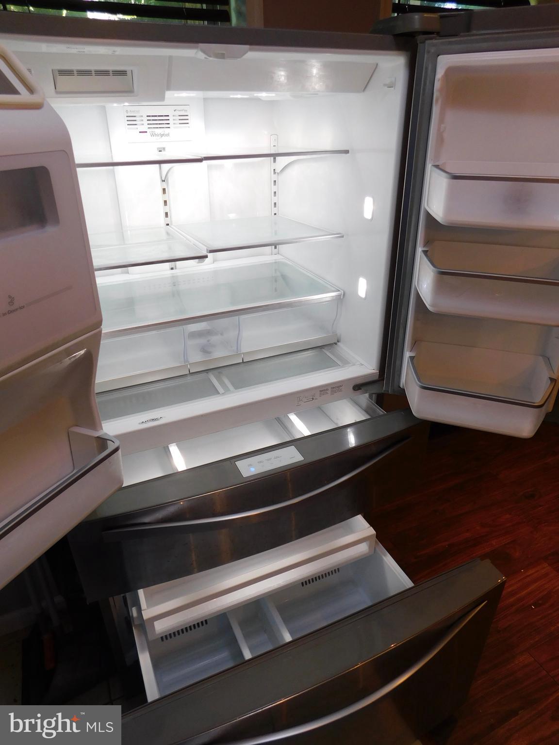 7009 Fieldcrest Road Baltimore, MD 21215 - Photo 7 of 46 a refrigerator in a kitchen
