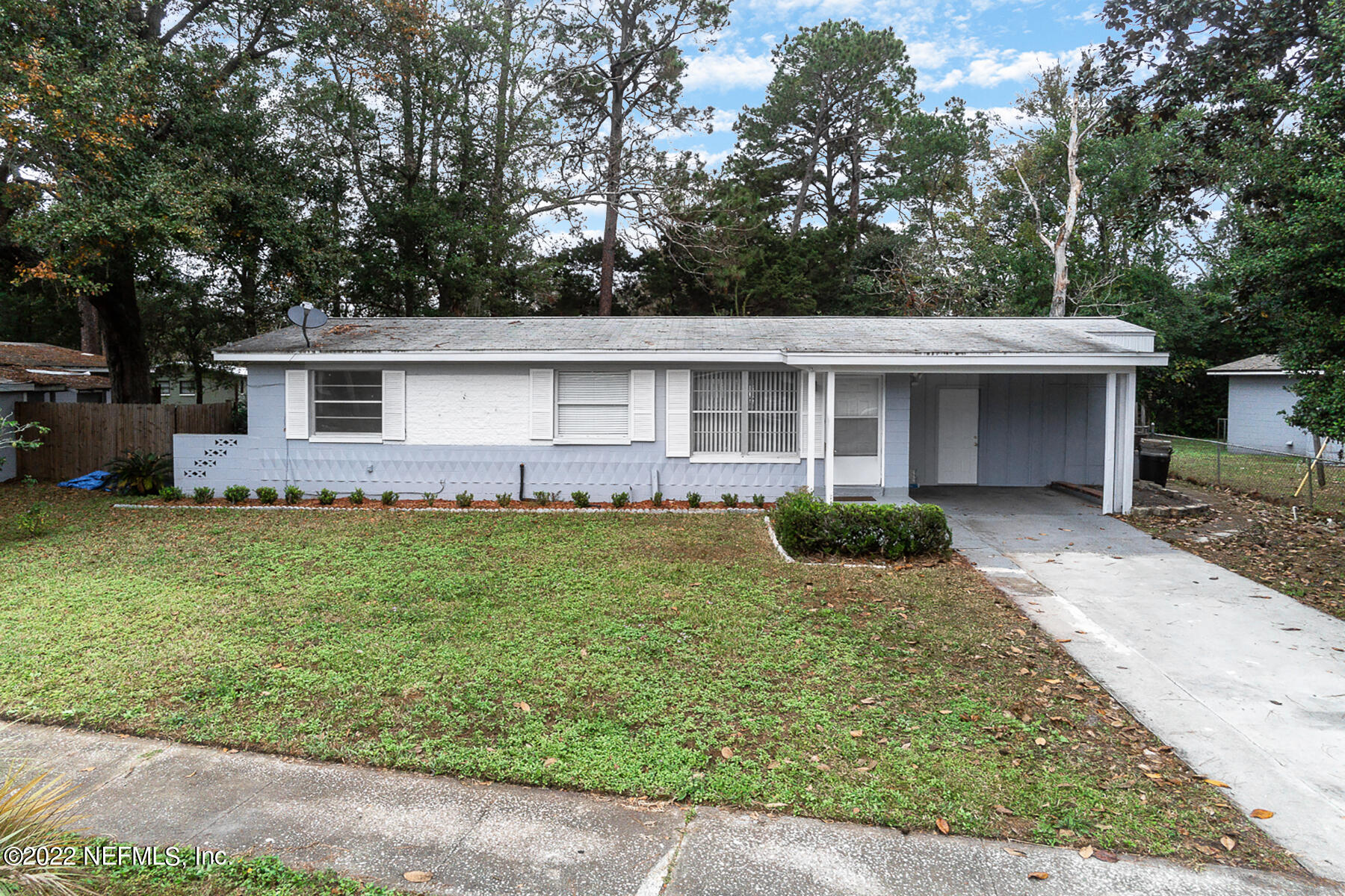 7403 Proxima Road Jacksonville, FL 32210 - Photo 1 of 30 front view of a house with a yard