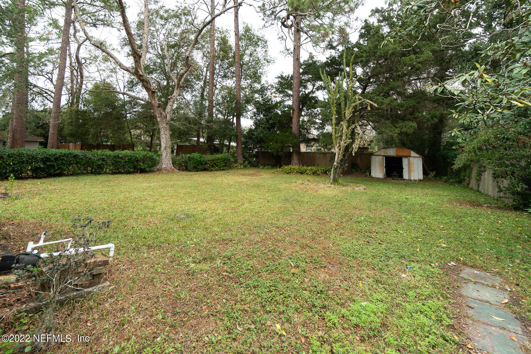 7403 Proxima Road Jacksonville, FL 32210 - Photo 12 of 30 a view of a field with a tree