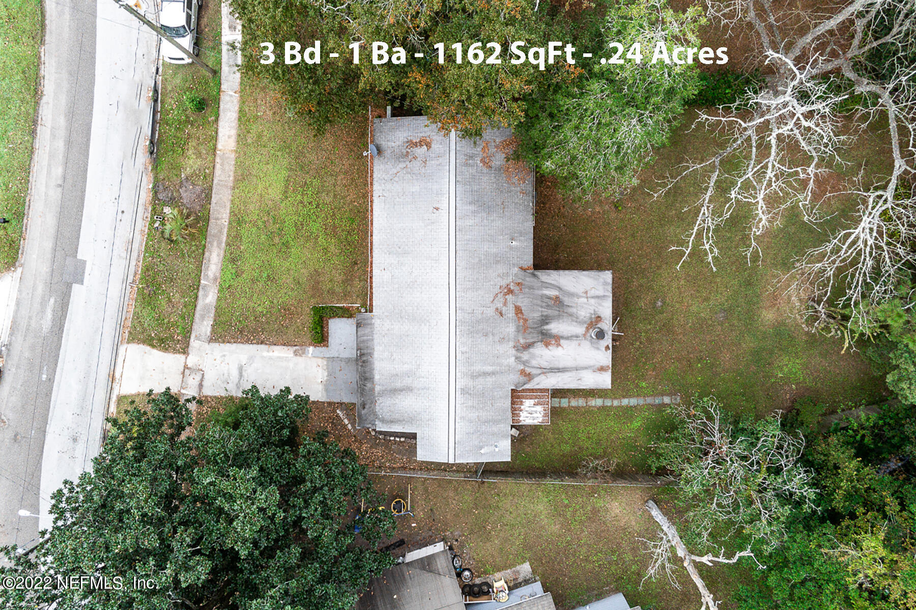 7403 Proxima Road Jacksonville, FL 32210 - Photo 14 of 30 an aerial view of a house with a yard