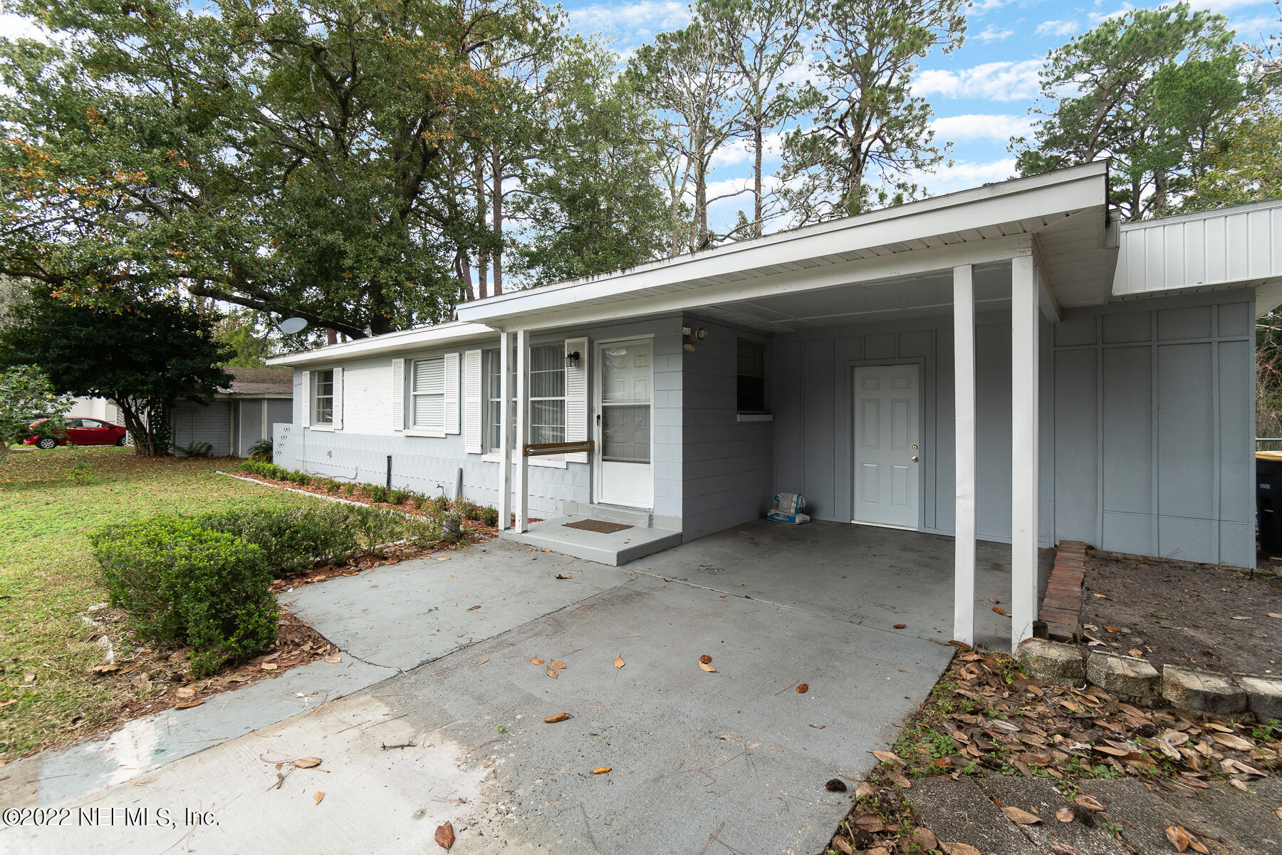 7403 Proxima Road Jacksonville, FL 32210 - Photo 15 of 30 a view of a house with a yard