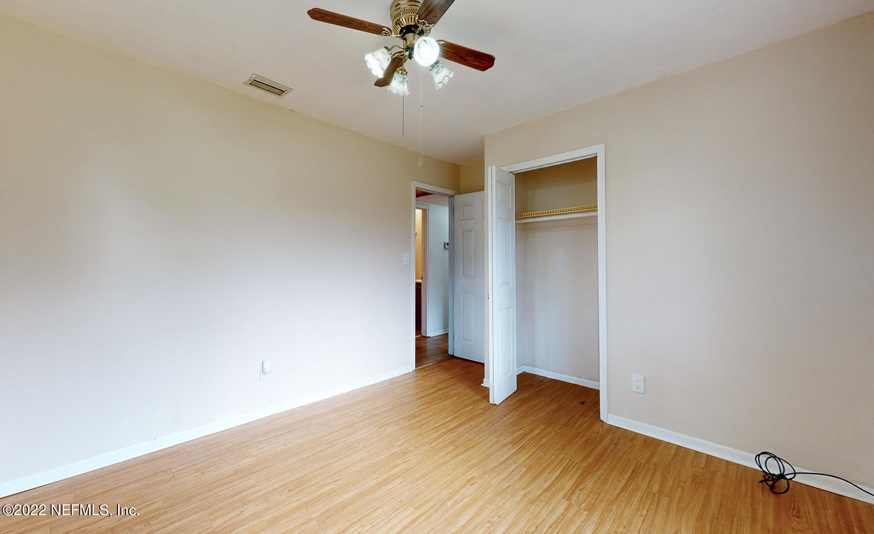 7403 Proxima Road Jacksonville, FL 32210 - Photo 21 of 30 a view of an empty room with wooden floor
