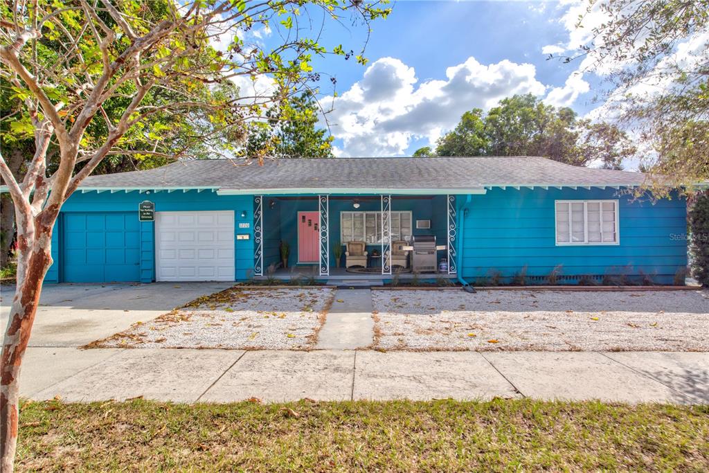 1270 5th Street Sarasota, FL 34236 - Photo 1 of 29 a front view of a house with a yard and garage