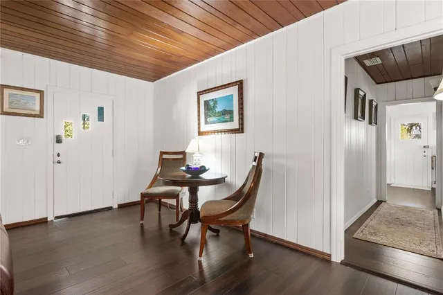 a workspace with furniture and wooden floor