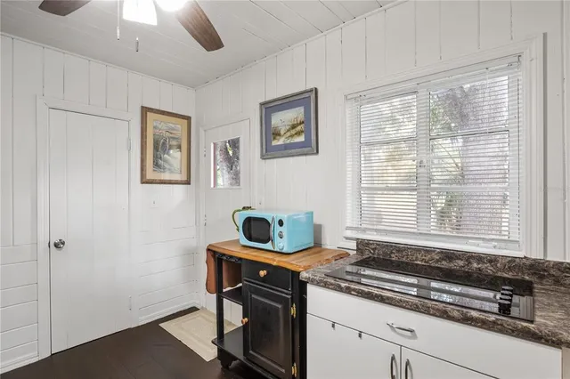 a kitchen with a stove and a window