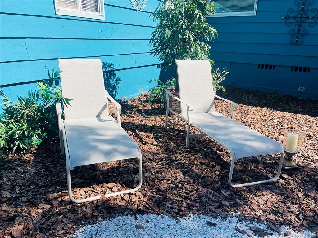 1270 5th Street Sarasota, FL 34236 - Photo 6 of 29 a wooden bench sitting in front of a house