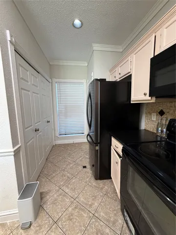 a kitchen with stainless steel appliances a refrigerator and a sink