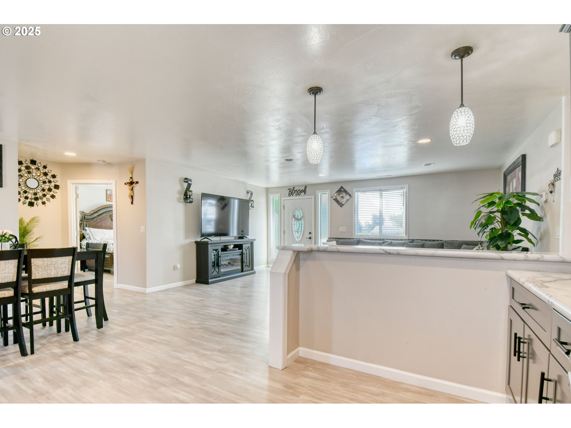 256 Northwest Jewell Court Irrigon, OR 97844 - Photo 12 of 47 a kitchen with stainless steel appliances granite countertop a sink dishwasher and a wooden floor