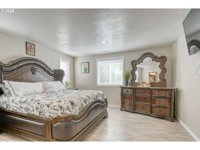 a bedroom with a bed and a dresser