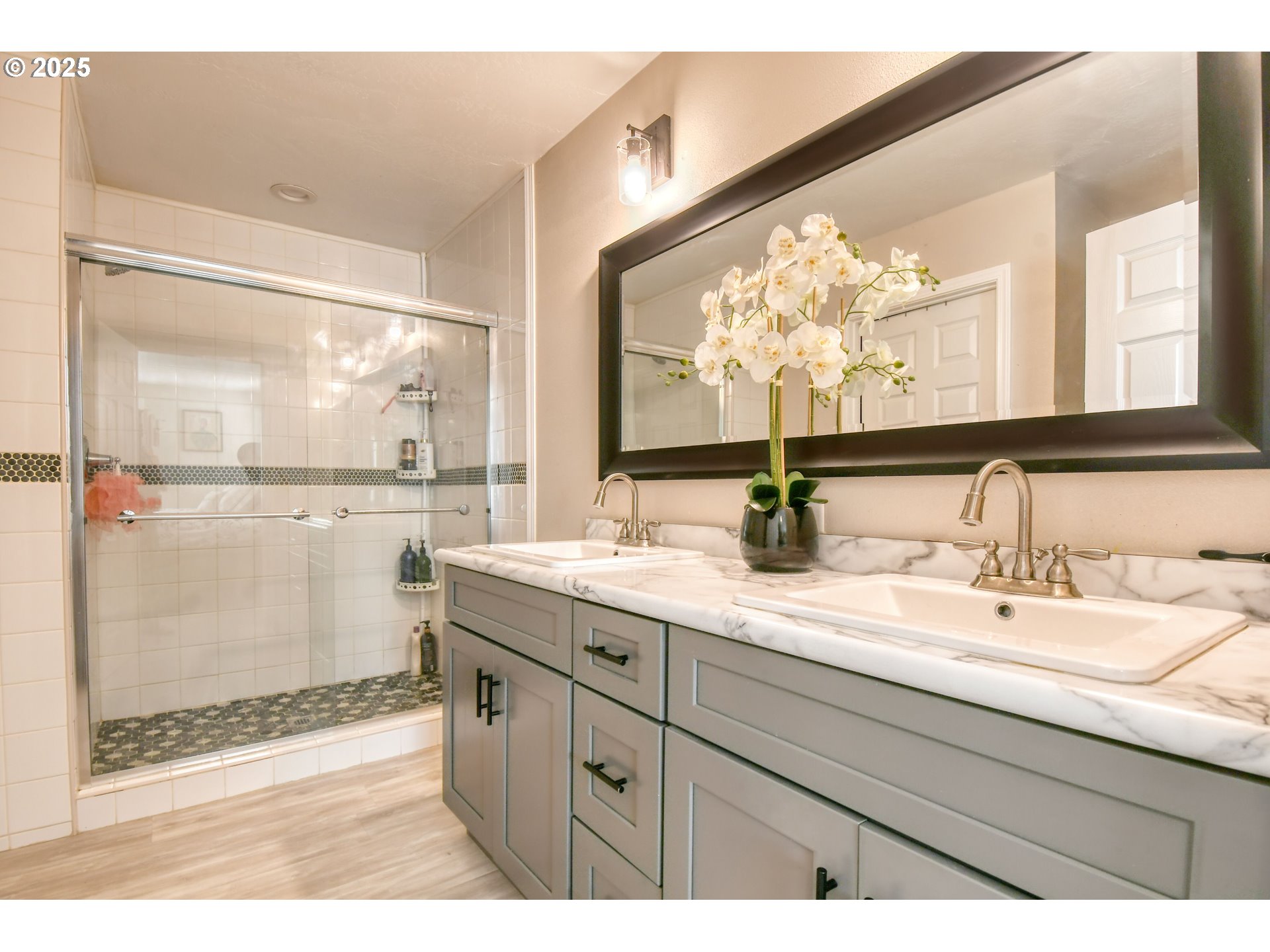 256 Northwest Jewell Court Irrigon, OR 97844 - Photo 15 of 47 a bathroom with a double vanity sink mirror and shower