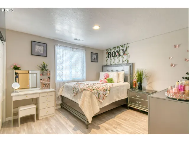 a bedroom with a bed and a table in it