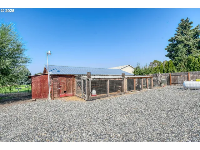 an outdoor space with wooden fence