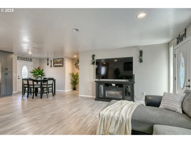 a bedroom with furniture and a flat screen tv