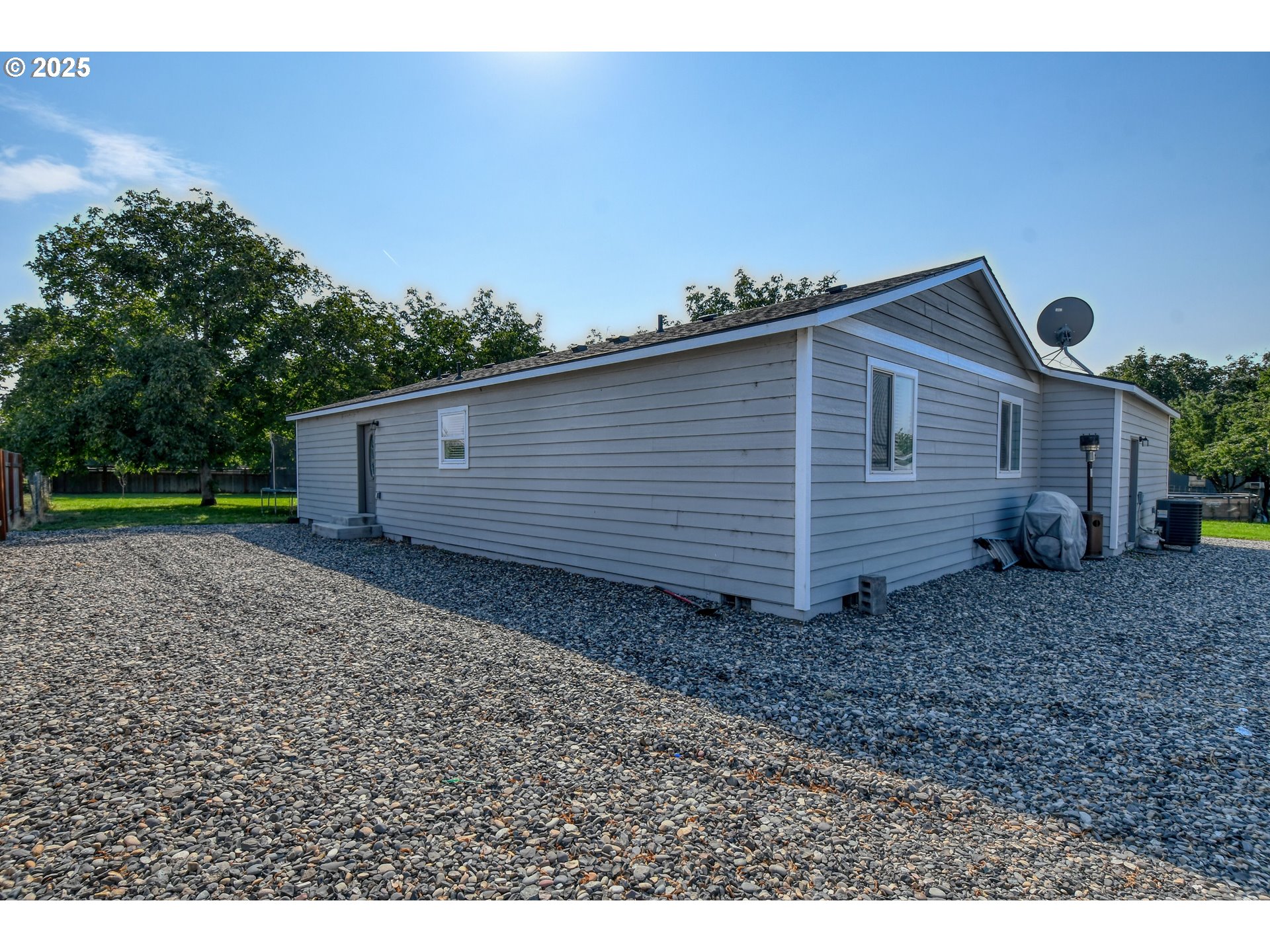 256 Northwest Jewell Court Irrigon, OR 97844 - Photo 41 of 47 a view of a house with a backyard