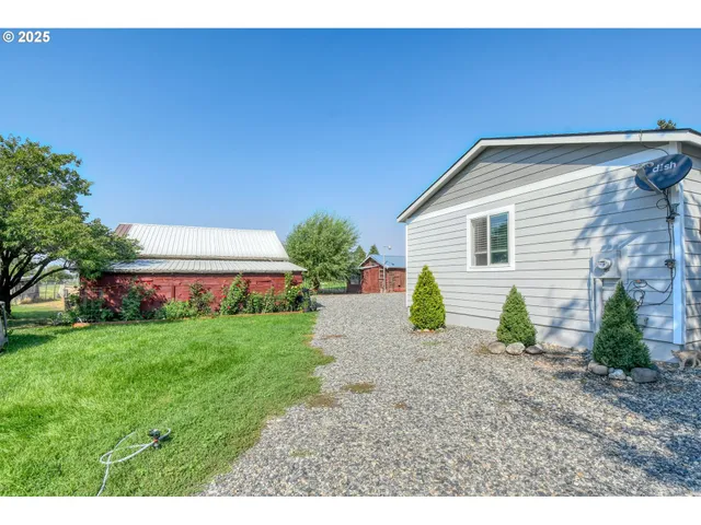 a view of an house with backyard space and garden