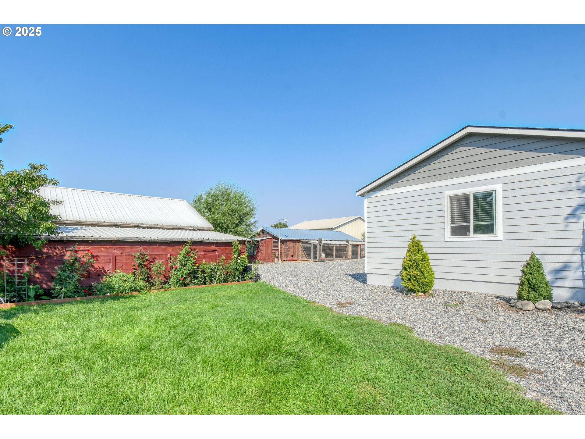 256 Northwest Jewell Court Irrigon, OR 97844 - Photo 47 of 47 a view of an house with backyard space and garden