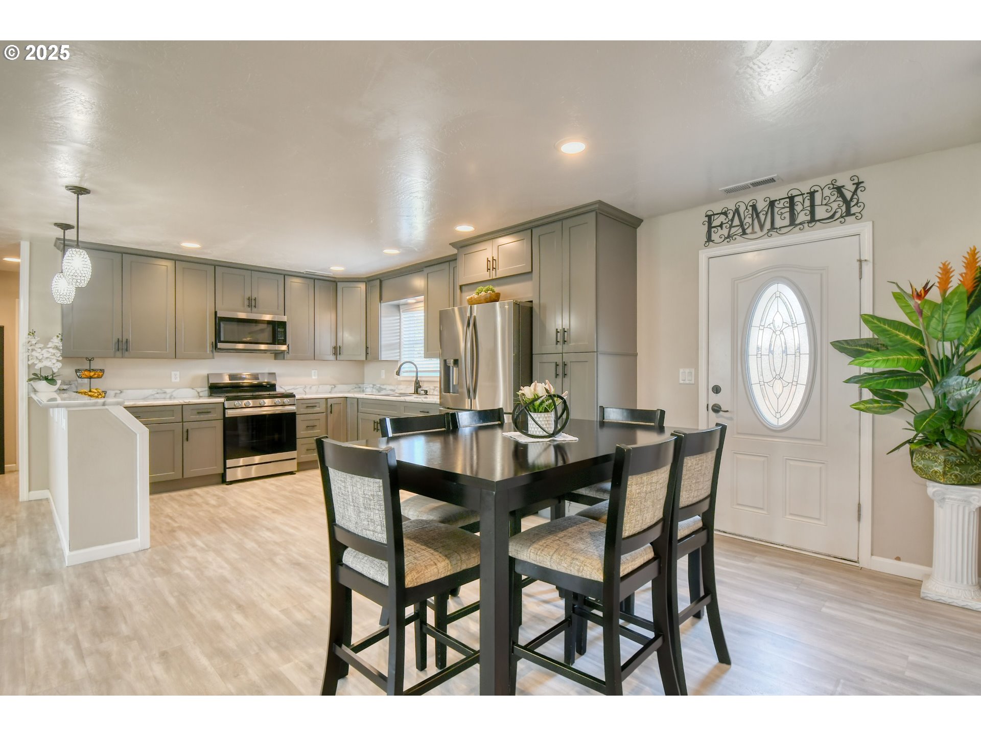 256 Northwest Jewell Court Irrigon, OR 97844 - Photo 7 of 47 a view of a dining room with furniture and wooden floor