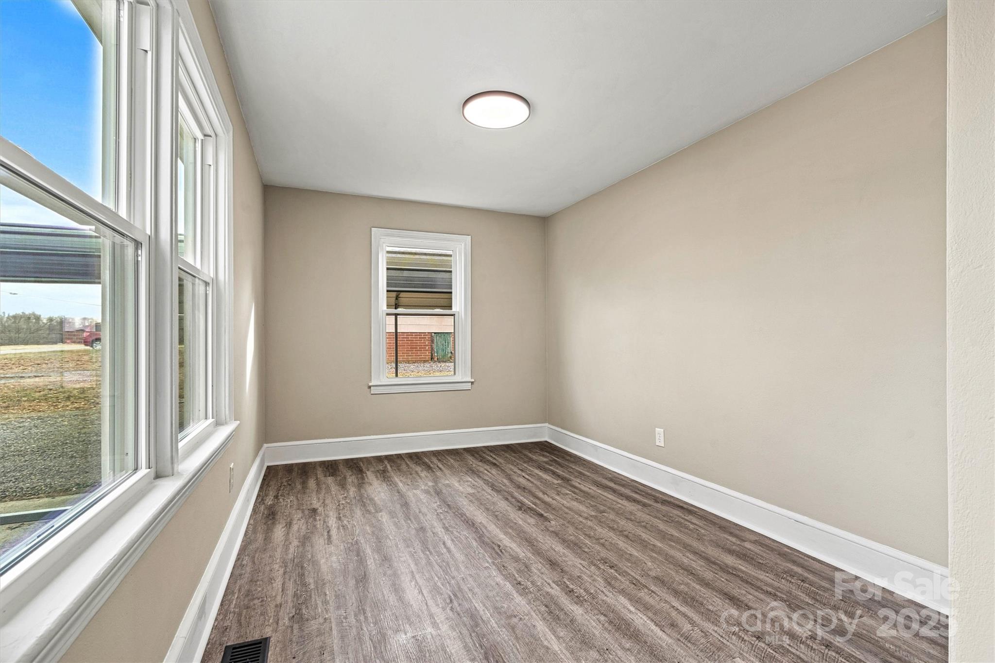 2829 1st Avenue Northwest Hickory, NC 28601 - Photo 11 of 22 a view of a room with wooden floor and a window