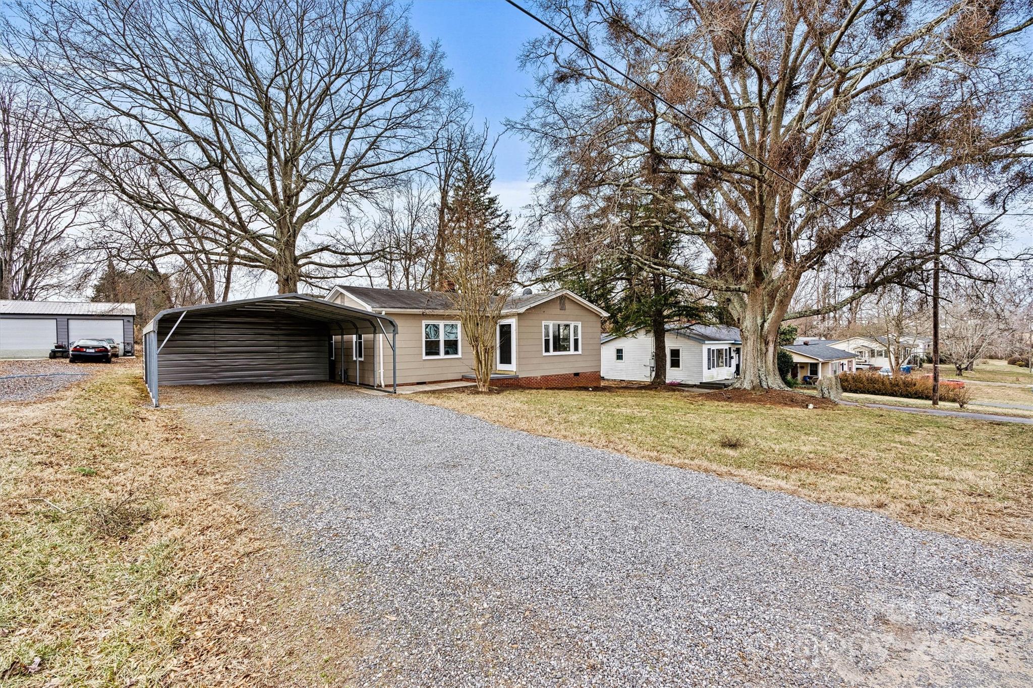 2829 1st Avenue Northwest Hickory, NC 28601 - Photo 16 of 22 a front view of a house with a yard and garage