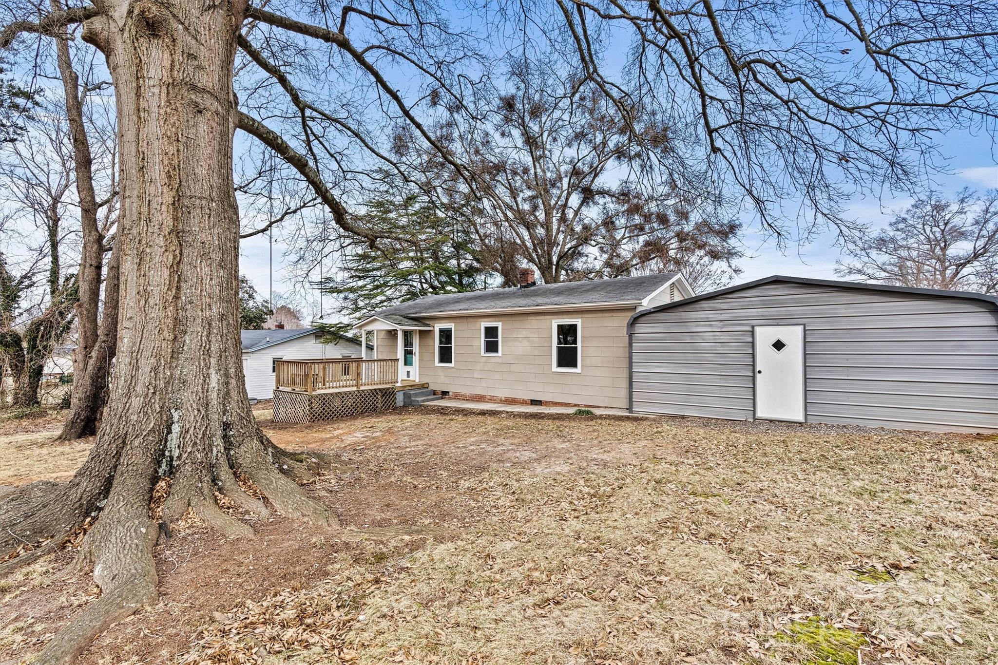 2829 1st Avenue Northwest Hickory, NC 28601 - Photo 22 of 22 a house that has a tree in front of it