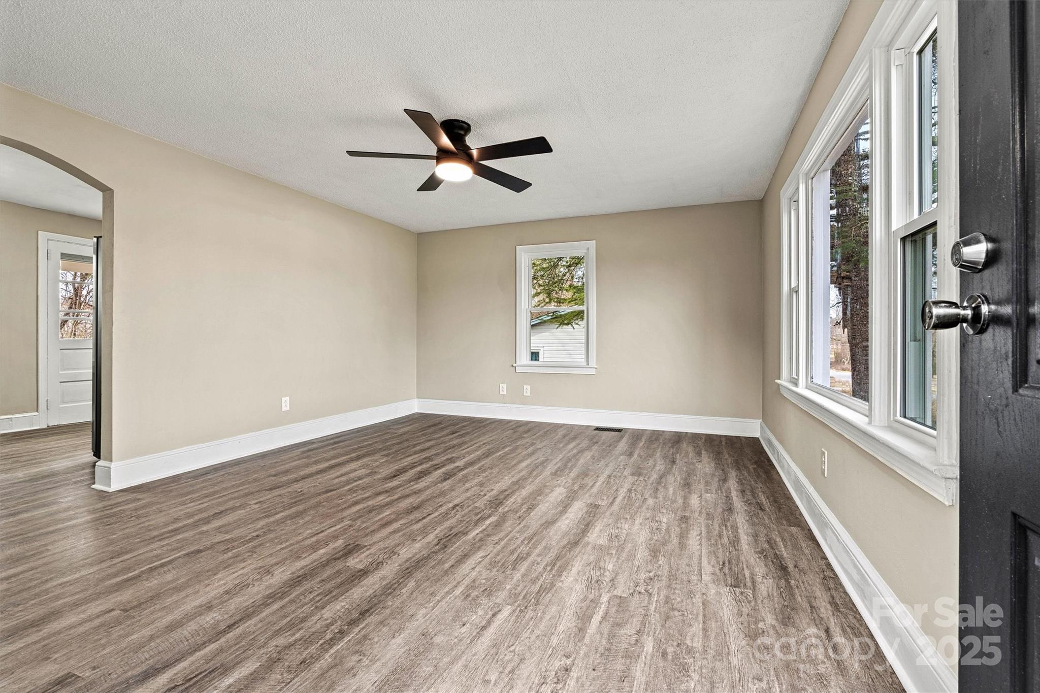 2829 1st Avenue Northwest Hickory, NC 28601 - Photo 3 of 22 wooden floor in an empty room with a window