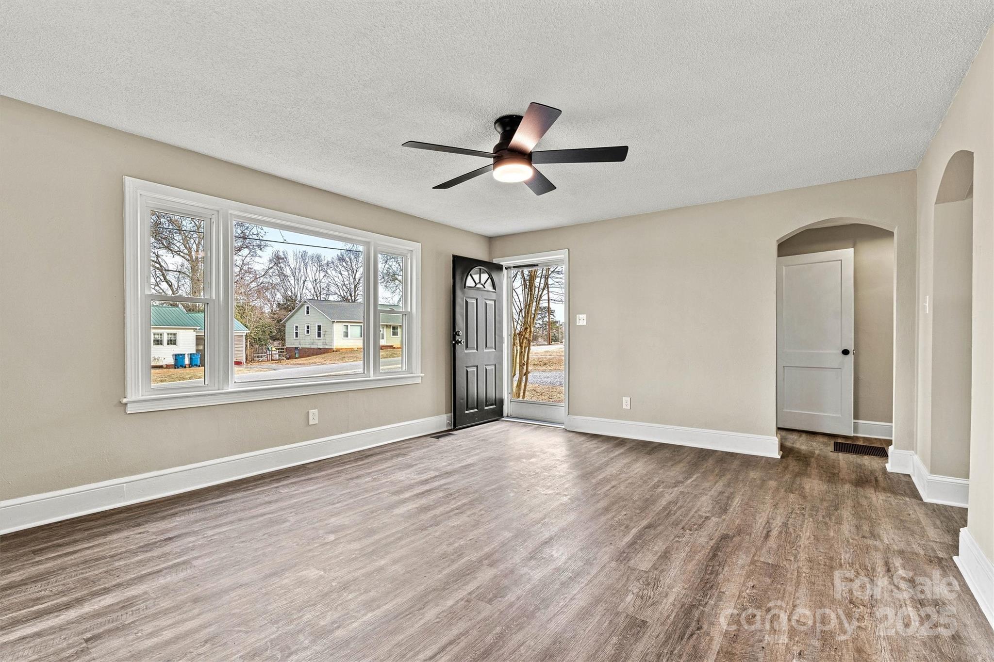 2829 1st Avenue Northwest Hickory, NC 28601 - Photo 4 of 22 wooden floor in an empty room with a window