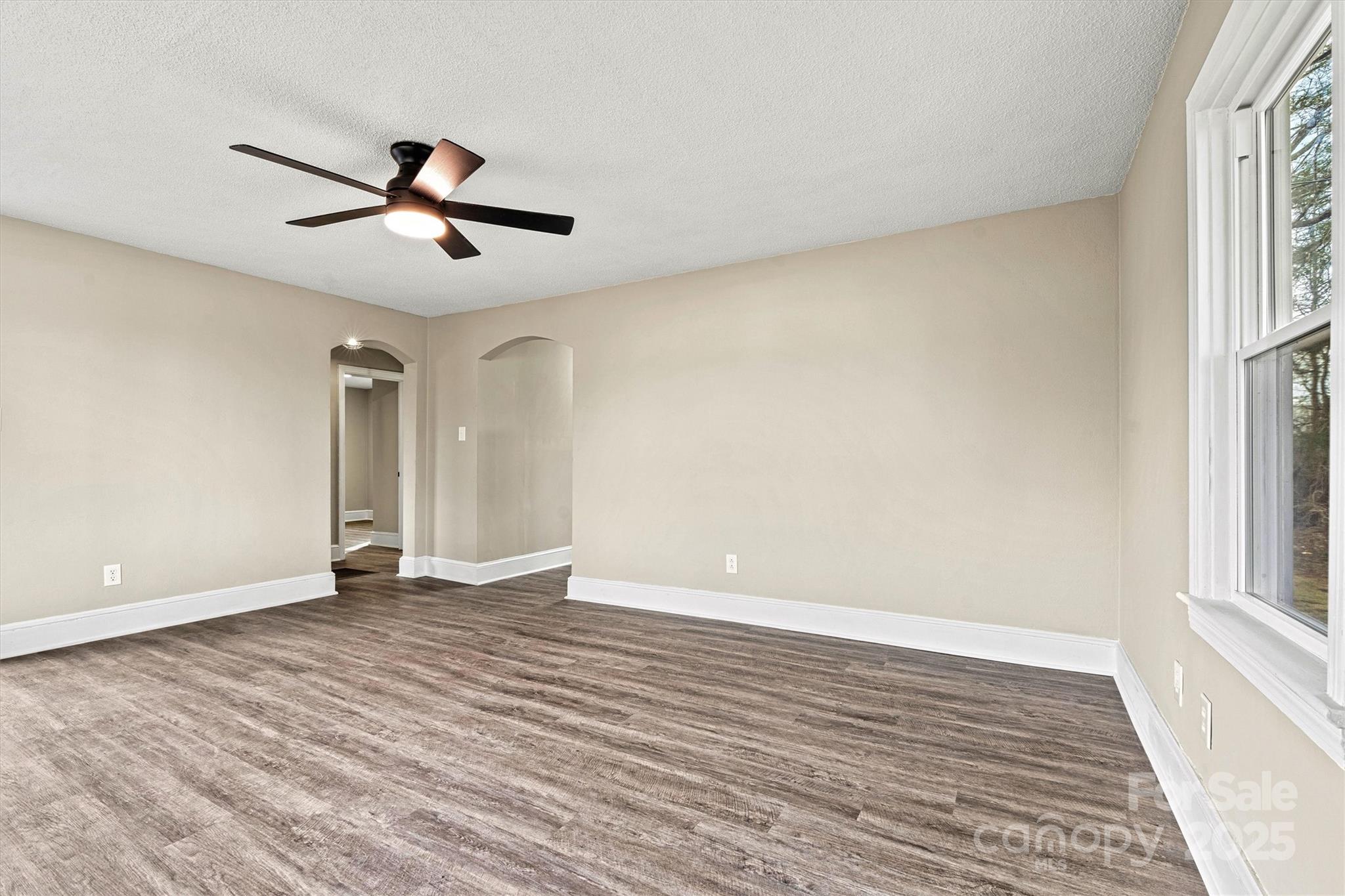 2829 1st Avenue Northwest Hickory, NC 28601 - Photo 5 of 22 an empty room with wooden floor and windows