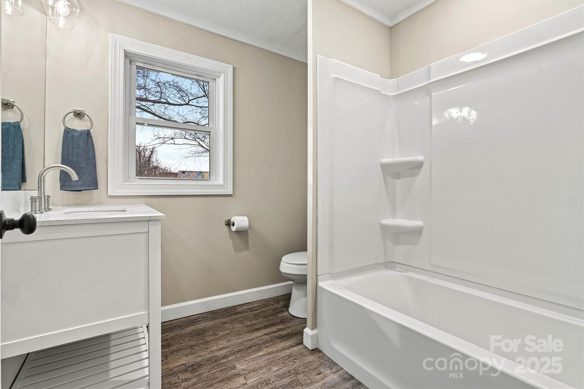 2829 1st Avenue Northwest Hickory, NC 28601 - Photo 10 of 22 a bathroom with a toilet a sink and bathtub