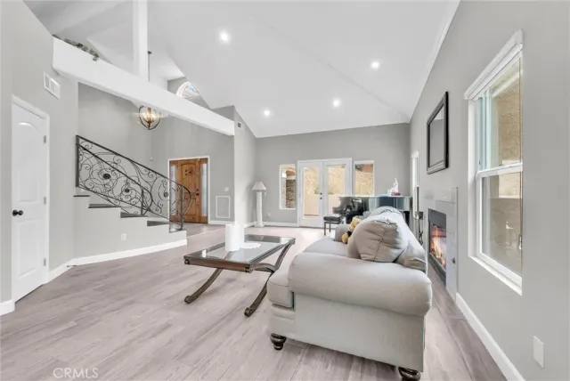 a dining room with wooden floor and a window