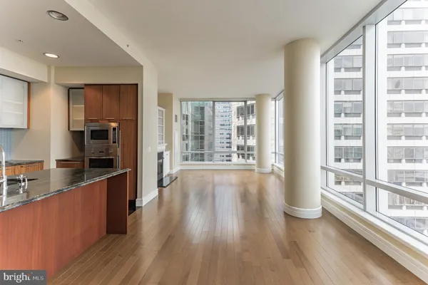 wooden floor in an empty room with a window and wooden floor