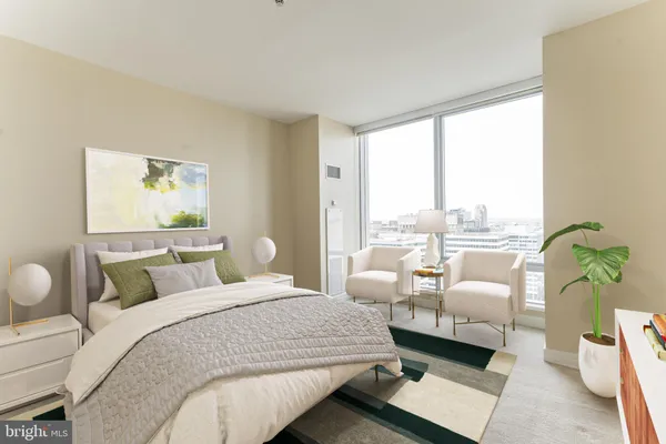 a bedroom with bed and windows