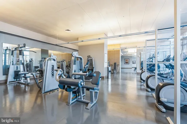 a room with gym equipment and a large window