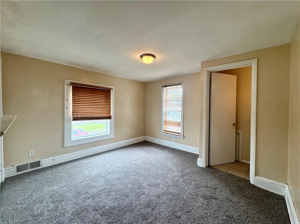 442 Park Street Rochester, PA 15074 - Photo 14 of 31 an empty room with windows and closet