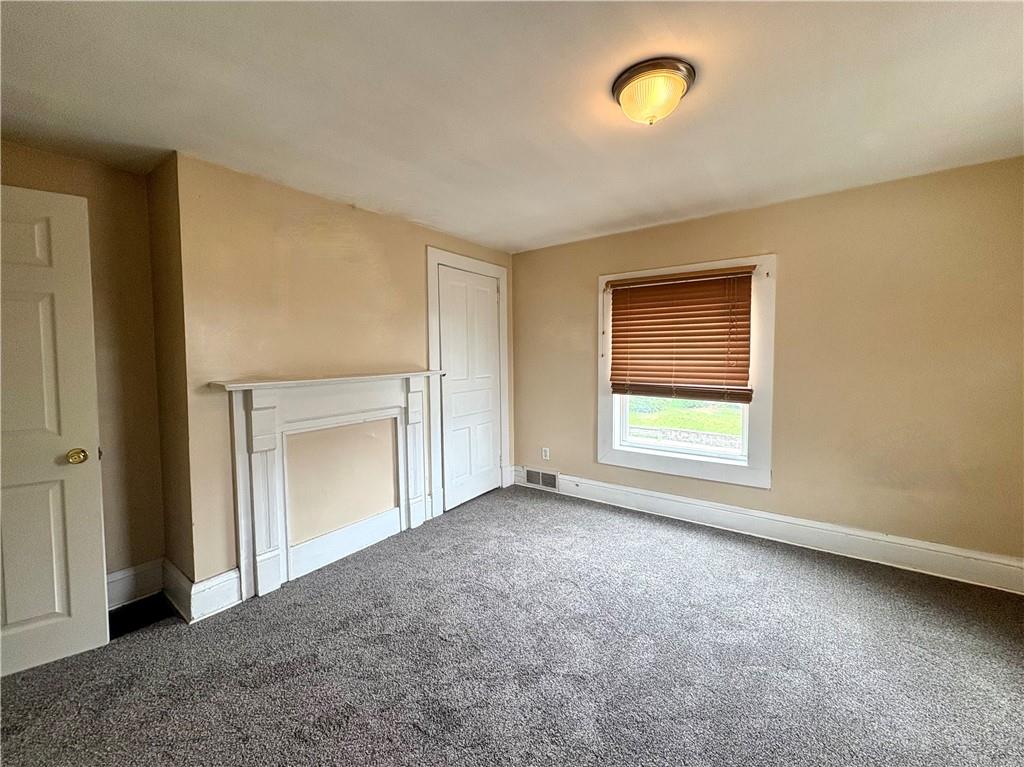 442 Park Street Rochester, PA 15074 - Photo 15 of 31 an empty room with windows and closet